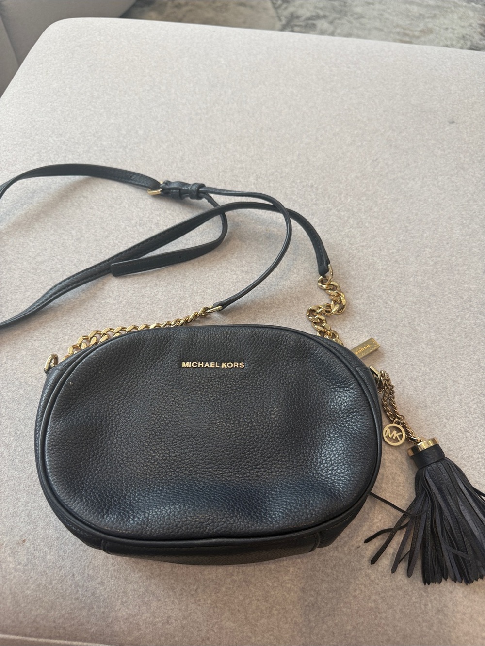 Michael Kors Black Pebbled Leather Oval Crossbody with Gold Chain & Tassel